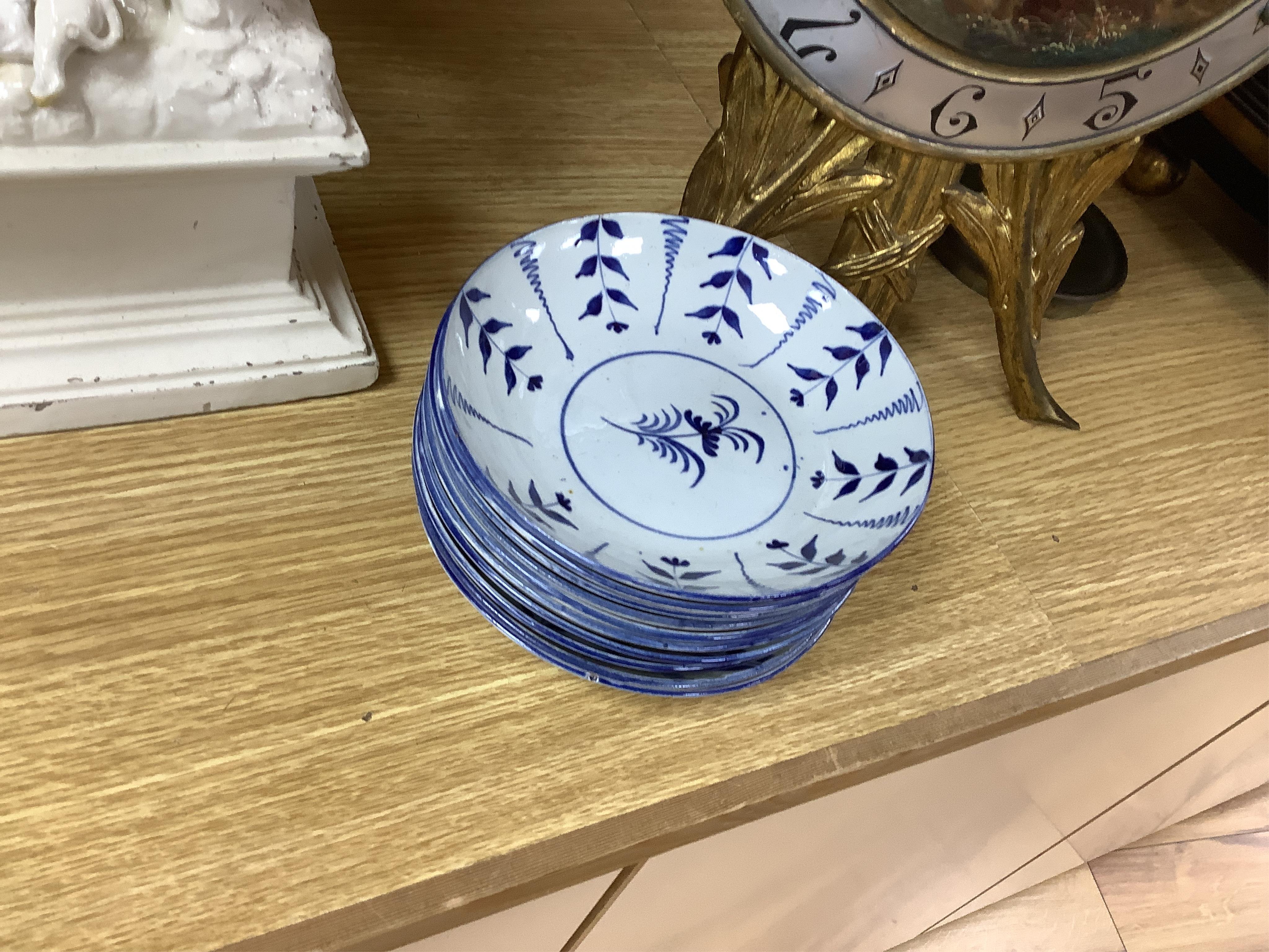 A group of 19th century pearlware set of tea bowls and saucers and to similar basket with border plates